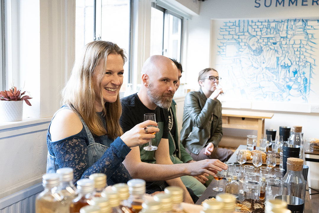 Guests drinking whisky at Whisky & Doughnuts experience in Summerhall Drinks Lab